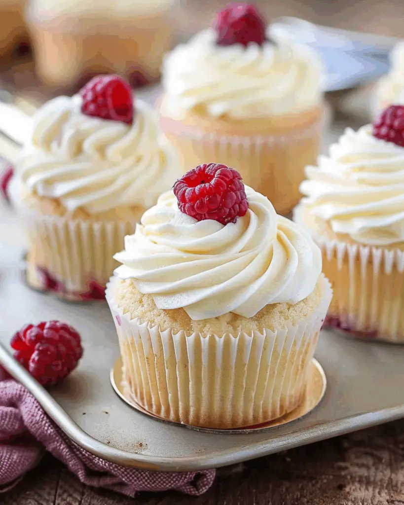 Almond Wedding Cake Cupcakes with Raspberry Filling